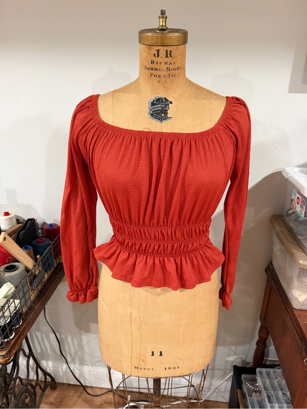 iris Rust Red Smocked Peplum Long Sleeve Top